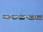 Genuine Mopar Dodge Nameplate 57010592AA. Fixed Price $13.05.