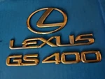 Lexus GS400 Sedan 2000 Rear Deck Lid Gold Plastic Oem Emblems Set Used. Fixed Price $74.50.