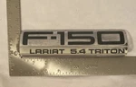 2004-2008 Ford F150 Lariat 5.4 Triton Emblem Oem 5L34-16B114-PA. Fixed Price $9.99.