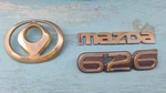 93-97 Mazda 626 Rear Trunk Emblem Nameplate Badge Insignia Gold Plated Oem. Fixed Price $19.99.