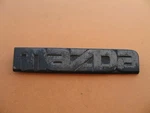 Mazda Front Emblem Logo Badge Sign Symbol Used UB8351711 A27074. Fixed Price $20.00.