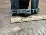 Ford Fiesta Part # 77FBB42 550BA Name Badge Emblem Vintage Plastic. Fixed Price $9.25.