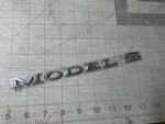New Genuine Tesla Model Badge / Emblem 1013738-00-C. Fixed Price $38.00.