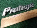 Mazda Protege Trunk Emblem Badge Decal Logo Symbol Oem Factory Genuine 3S1. Fixed Price $18.99.