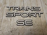 Pontiac Trans Sport Black White Front Side Door Emblem Nameplate Badge Set. Fixed Price $18.00.