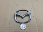 Mazda Oem 1998-2002 626 Protege Rear Emblem Badge Logo Nameplate B25D 51 730. Fixed Price $10.99.