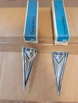 Nos Gm Pontiac 1961 Tempest Rear Quarter Arrowhead Emblems Pair 482757. Fixed Price $165.00.