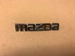 Mazda Emblem 9M81-54431C39-AD. Fixed Price $5.00.