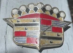 1952 Cadillac Hood Plastic Crest, Gold Bezel 1458439, Emblem. Fixed Price $252.00.