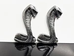 Original 1960'S 1970'S Shelby Cobra Snake Emblem's X2 Part #C90B-16228-A. Fixed Price $115.00.