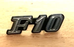 Datsun F10 Emblem Plastic Badge Oem 78802 M6900 Mid 70. Fixed Price $14.75.