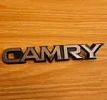 1983-1986 Toyota "camry" Plastic Trunk Emblem P/n 75442-32010 Removed. Fixed Price $12.99.