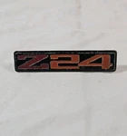 1986-1987 Chevrolet Cavalier "Z24" Metal Interior Door Emblem Used 20597750. Fixed Price $14.99.