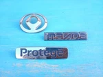 Mazda Protege 1995-1996 Emblem Badge Logo Nameplate Rear Set Oem. Fixed Price $14.99.