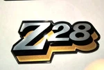 1978 78-81 Z28 Rear Center Gas Fuel Door Emblem Chrome #78Z Yellow And Gold. Fixed Price $69.95.