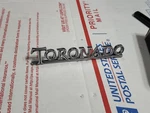 Nos 1967-1971, 1975 Oldsmobile Toronado Trunk Emblem-part No. 9864290. Fixed Price $75.00.