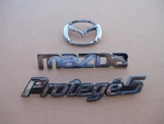 2002 2003 Mazda Protege 5 Rear Chrome Emblem Logo Badge Sign Used A47336. Fixed Price $30.00.