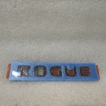 Genuine Nissan Rogue Nameplate 84894-JM00A Oem. Fixed Price $40.00.