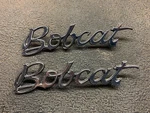 Two 1975-78 Mercury Bobcat Emblem Oem #D5YB-16B114-AA. Fixed Price $39.99.