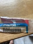 2006-2009 Mazda 2.3 Front Door Emblem 0000-8R-L16 0000-89-L16. Fixed Price $12.00.