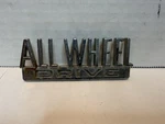 1961-1971 International Harvester Scout All Wheel Drive Emblem Original. Fixed Price $32.00.