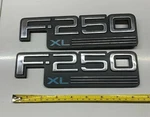 Pair Oem 92-97 Ford "F250 Xl" Fender Emblems Part# F2TB-16B114. Fixed Price $29.95.