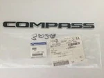 New Genuine Mopar 68547001AA Front Door Nameplate Right 2017-2025 Jeep Compass. Fixed Price $70.00.