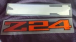 1991-1994 Cavalier Z/24 Red & Orange Quarter Panel Insert Emblem. Fixed Price $35.00.