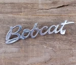 1975 Mercury Bobcat Chrome Fender Script Emblem Badge Oem #D5YB16B114AA. Fixed Price $18.95.