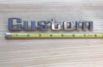 Custom Car Emblem. Vintage Original Part # D3TB99291A36BB. Fixed Price $25.00.