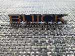1985 - 1991 Buick Gold Grille Emblem Lesabre Park Avenue Nameplate Nos #25515410. Fixed Price $30.00.