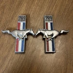 Preowned 68 Mustang 289 Fender Emblems C8ZZ-16228-A Pair #1. Fixed Price $50.00.