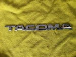 2005 -2015 Toyota Tacoma Front Nameplate Badge Emblem Oem -used #75427-04010-20. Fixed Price $20.00.