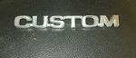 1976 1977 1978 Ford Truck "custom" Emblem #1. Fixed Price $25.00.