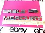 Mercury Sable Gs 1987-1991 Rear Emblems Badges Oem Used. Fixed Price $26.24.