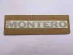 Mitsubishi (MB778137)I Montero Emblem , Dark Beige. Nameplate - Made In Japan. Fixed Price $46.00.