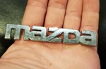 Mazda Nameplate Emblem Chrome Letter Badge GA2K 51 711 Oem Used. Fixed Price $8.75.