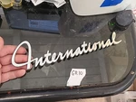 1960-67 International Truck Fender Emblem Oem 242692-R1..BIN GR10 61 62 63 64... Fixed Price $82.99.