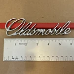 Nos 71-76 Oldsmobile Cutlass Starfire Omega Trunk Script Emblem 1700884 9858566. Fixed Price $99.99.