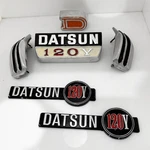 Datsun 120Y Side Badges, Grill, Rear And Piller B210 Emblems In Metal. Fixed Price $83.00.