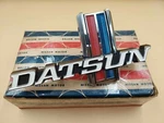 Datsun 620 J13 Front Emblem 62305-B5000 Genuine Nos Japan. Fixed Price $145.00.