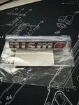 New Genuine Oem Nissan 370Z Nismo Logo Front Bumper Nameplate Emblem 62890-6GA0A. Fixed Price $85.00.