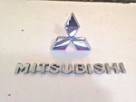 00-03 Mitsubishi Galant Rear Trunk Emblem Silver Chrome Genuine P# MR971393. Fixed Price $29.95.