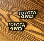 Reproduction 84-88 Toyota 4WD B-pillar Badges Emblems Left And Right Set Pair. Fixed Price $99.00.