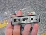 Amc Rambler Nos "dpl" Emblem Badge Nameplate # 4483743 Ambassador 3553875. Fixed Price $10.00.