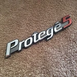 2002-2003 Mazda PROTEGE5 Rear Emblem Trunk Badge Genuine Oem Part. Fixed Price $9.95.