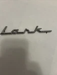 Vintage Studebaker Lark Metal Emblem Badge 69104 1332235. Fixed Price $24.95.
