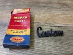 1957-58 Plymouth Savoy Custom Nos Mopar 1/4 Panel Script Emblem 1686259. Fixed Price $65.00.