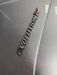 'evolution Iv' Rear Emblem To Suit Mitsubishi Lancer 4 MR300579. Fixed Price $350.00.