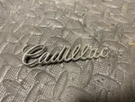 Cadillac Trunk Script Emblem Pt# 1490598. Fixed Price $25.00.
